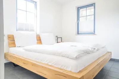 Ein Bett oder Betten in einem Zimmer der Unterkunft Kranichhus Kranich 4