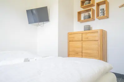 Ein Bett oder Betten in einem Zimmer der Unterkunft Kranichhus Kranich 4