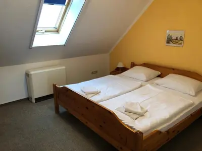 Ein Bett oder Betten in einem Zimmer der Unterkunft -