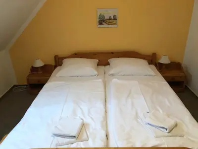 Ein Bett oder Betten in einem Zimmer der Unterkunft -