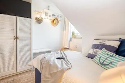 Ein Bett oder Betten in einem Zimmer der Unterkunft Sonnenblick-Turmoase 06