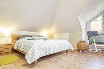 Ein Bett oder Betten in einem Zimmer der Unterkunft Sonnenblick-Turmoase 06