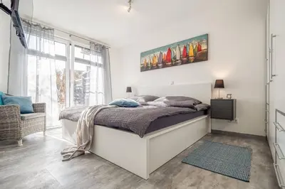 Ein Bett oder Betten in einem Zimmer der Unterkunft Küstenliebe 01