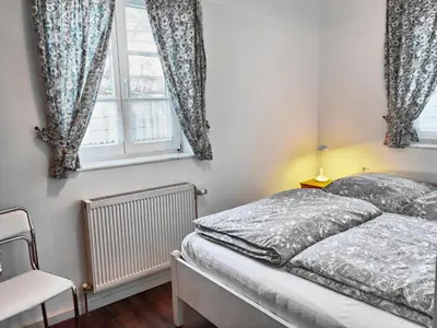 Ein Bett oder Betten in einem Zimmer der Unterkunft Achtern Diek 4b FW 3