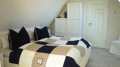 Ein Bett oder Betten in einem Zimmer der Unterkunft Kapitän Parow Fregatte FW 7