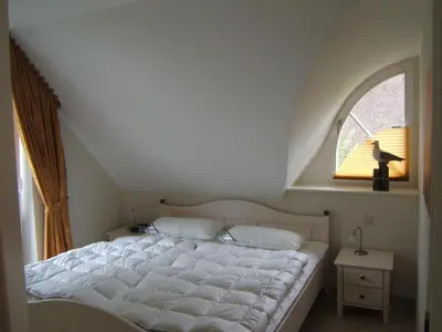 Ein Bett oder Betten in einem Zimmer der Unterkunft Deichidyll
