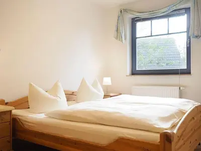 Ein Bett oder Betten in einem Zimmer der Unterkunft Kormoran - W3