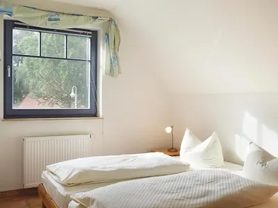 Ein Bett oder Betten in einem Zimmer der Unterkunft Kormoran - W3