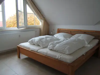 Ein Bett oder Betten in einem Zimmer der Unterkunft Seewolf