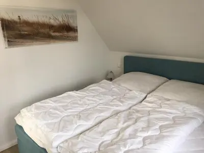 Ein Bett oder Betten in einem Zimmer der Unterkunft Piratennest 1