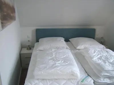 Ein Bett oder Betten in einem Zimmer der Unterkunft Piratennest 1