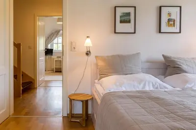 Ein Bett oder Betten in einem Zimmer der Unterkunft Achtern Diek
