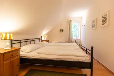 Ein Bett oder Betten in einem Zimmer der Unterkunft Künstlerhaus Rosenthal 01