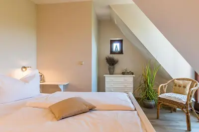 Ein Bett oder Betten in einem Zimmer der Unterkunft Nele Nelsson Hus, Landhaus Haven Höövt