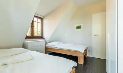 Ein Bett oder Betten in einem Zimmer der Unterkunft Windflüchter, Landhaus Haven Höövt