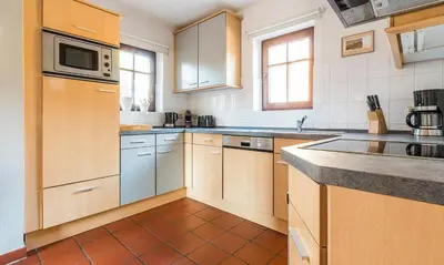 Küche/Küchenzeile in der Unterkunft Windflüchter, Landhaus Haven Höövt