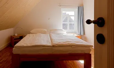 Ein Bett oder Betten in einem Zimmer der Unterkunft Kapitänshaus - Kajüte