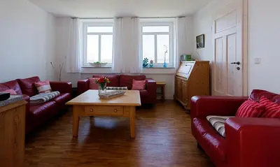 Ein Sitzbereich in der Unterkunft Kapitänshaus - Kajüte