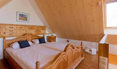 Ein Bett oder Betten in einem Zimmer der Unterkunft Kapitänshaus - Atelier