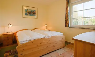 Ein Bett oder Betten in einem Zimmer der Unterkunft Am Paetowhof 3 4