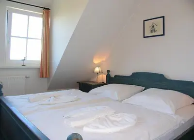Ein Bett oder Betten in einem Zimmer der Unterkunft Seebär