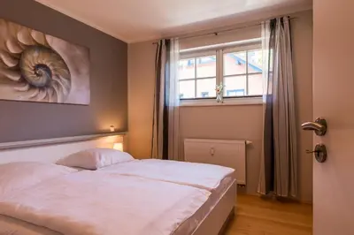 Ein Bett oder Betten in einem Zimmer der Unterkunft Mädesüß 01