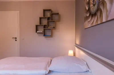 Ein Bett oder Betten in einem Zimmer der Unterkunft Mädesüß 01