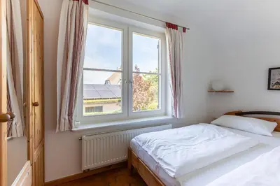 Ein Bett oder Betten in einem Zimmer der Unterkunft Haus am Hohen Ufer 01