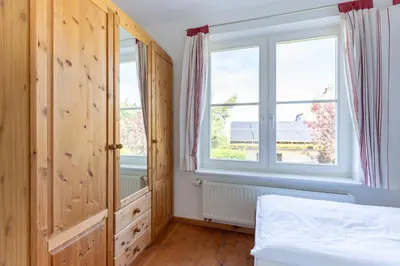 Ein Bett oder Betten in einem Zimmer der Unterkunft Haus am Hohen Ufer 01