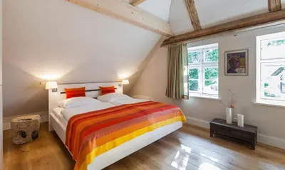 Ein Bett oder Betten in einem Zimmer der Unterkunft Schipperhaus 01