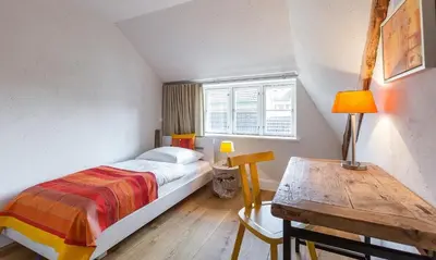 Ein Bett oder Betten in einem Zimmer der Unterkunft Schipperhaus 01