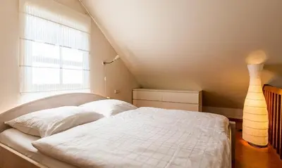 Ein Bett oder Betten in einem Zimmer der Unterkunft Alte Tischlerei 01