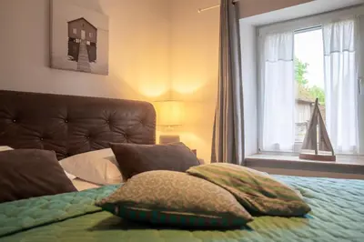 Ein Bett oder Betten in einem Zimmer der Unterkunft Sonnenwieck 01