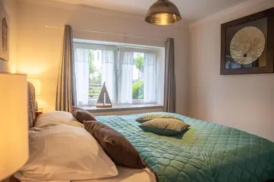 Ein Bett oder Betten in einem Zimmer der Unterkunft Sonnenwieck 01