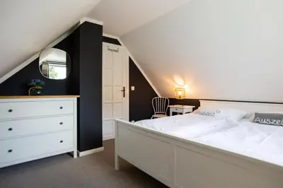 Ein Bett oder Betten in einem Zimmer der Unterkunft Sonnenwieck 02