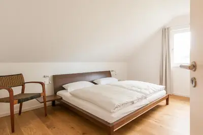 Ein Bett oder Betten in einem Zimmer der Unterkunft Zweienhaus 02