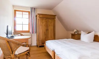 Ein Bett oder Betten in einem Zimmer der Unterkunft Haus am Bodden 02