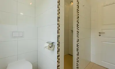 Ein Badezimmer in der Unterkunft Strandhaus Gabriella 02