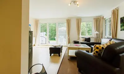 Ein Sitzbereich in der Unterkunft Strandhaus Gabriella 02