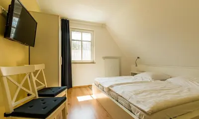 Ein Bett oder Betten in einem Zimmer der Unterkunft Strandhaus Gabriella 02