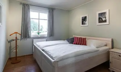 Ein Bett oder Betten in einem Zimmer der Unterkunft Boddenzauber 01