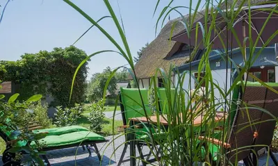 Ein Garten an der Unterkunft Haus Schilfkante - Wohnung 1