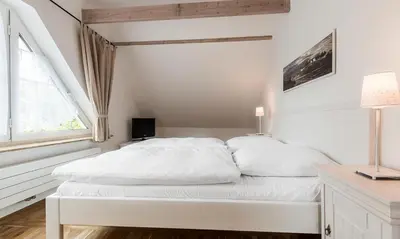Ein Bett oder Betten in einem Zimmer der Unterkunft Dünenblick 03