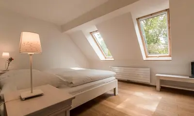 Ein Bett oder Betten in einem Zimmer der Unterkunft Dünenblick 03