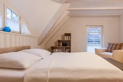 Ein Bett oder Betten in einem Zimmer der Unterkunft Fischerhus