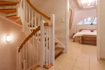 Ein Bett oder Betten in einem Zimmer der Unterkunft Fischerhus