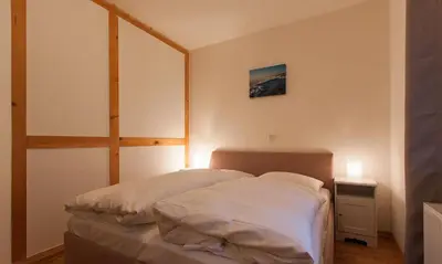 Ein Bett oder Betten in einem Zimmer der Unterkunft Haus Schilfkante - Wohnung 2