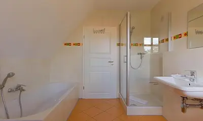 Ein Badezimmer in der Unterkunft Klönhus