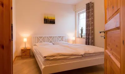 Ein Bett oder Betten in einem Zimmer der Unterkunft Haus Michel 02