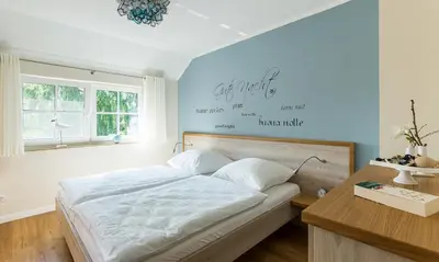 Ein Bett oder Betten in einem Zimmer der Unterkunft Haus Seeschwalbe